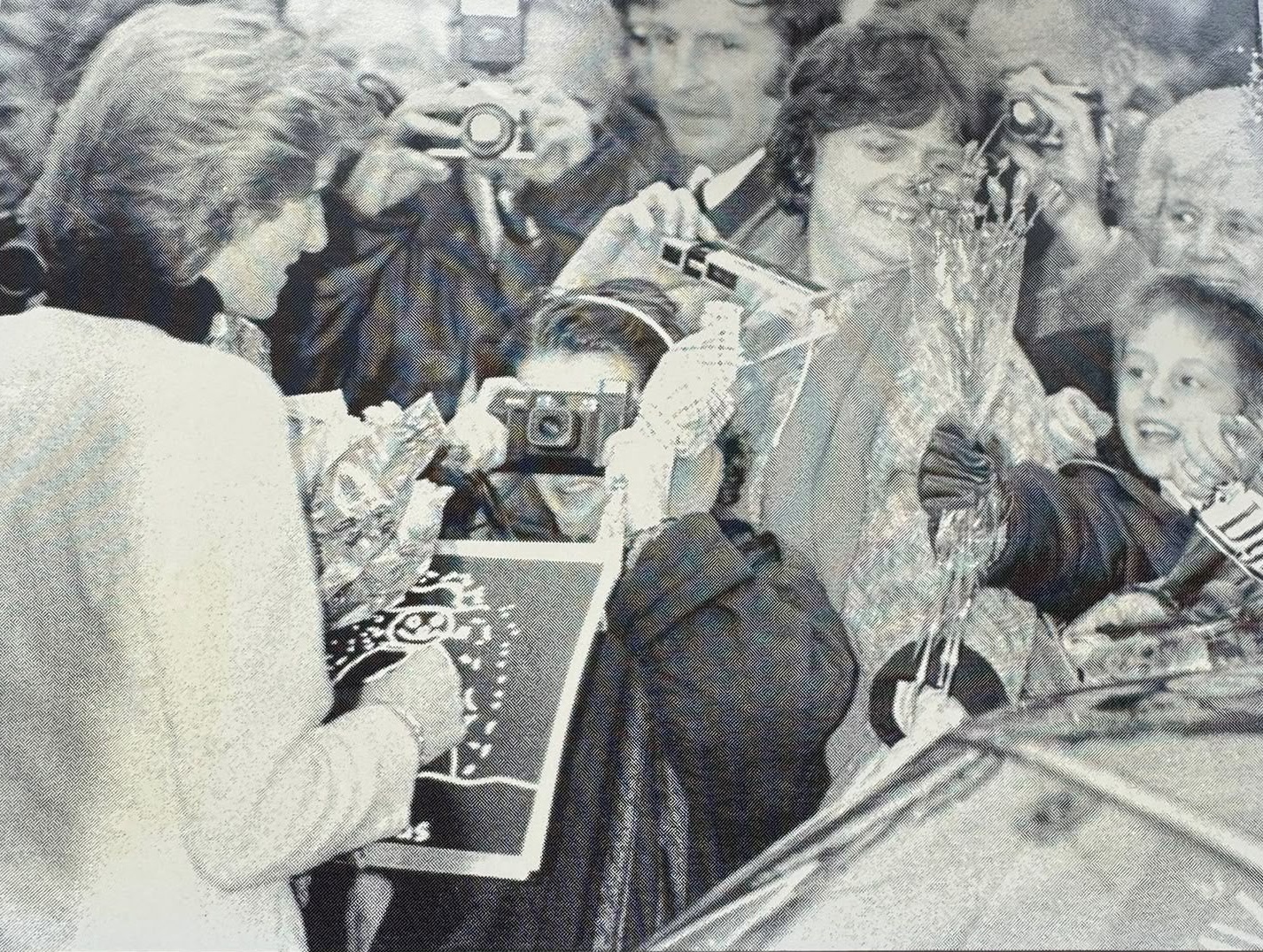A childhood photograph of Ryan Bridge presenting flowers to Diana, Princess of Wales, during her visit to Birmingham.